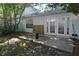View of backyard with a concrete patio and white siding at 1754 Torrington Cir, Longwood, FL 32750