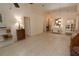 Open-concept living room features tile flooring, neutral walls, and ample natural light from the windows and fixtures at 1754 Torrington Cir, Longwood, FL 32750
