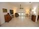 Open living area with tile floors, high ceilings, and a wall of sliding glass doors providing great natural light at 1754 Torrington Cir, Longwood, FL 32750