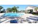 Community pool surrounded by deck chairs and tables at 1754 Torrington Cir, Longwood, FL 32750