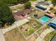 Sprawling property showcasing a well-maintained home, swimming pool, playground and spacious yard at 181 W Minnehaha Ave, Clermont, FL 34711