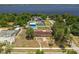 Lakefront home features a backyard pool and multiple structures at 181 W Minnehaha Ave, Clermont, FL 34711