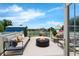 Back patio featuring a fire pit, playground, and seating with lake views at 181 W Minnehaha Ave, Clermont, FL 34711