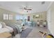 Inviting bedroom with tile flooring, fan, and lots of natural light at 181 W Minnehaha Ave, Clermont, FL 34711