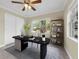 Spacious home office with sleek desk, natural light, and ample storage at 181 W Minnehaha Ave, Clermont, FL 34711