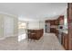 Open kitchen with granite countertops, stainless steel appliances, and an island with bar seating at 181 W Minnehaha Ave, Clermont, FL 34711