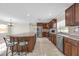 Spacious kitchen with an island, modern appliances, and dark wood cabinetry at 181 W Minnehaha Ave, Clermont, FL 34711