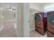 Convenient laundry room featuring modern stacked washer and dryer at 181 W Minnehaha Ave, Clermont, FL 34711