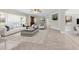 Bright and modern living room with tile floors, neutral decor, and a large window with view at 181 W Minnehaha Ave, Clermont, FL 34711