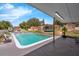 Resort-style pool with sun loungers, playground, and a covered patio perfect for relaxing at 181 W Minnehaha Ave, Clermont, FL 34711