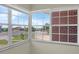 Bright sunroom with lake views from multiple windows at 181 W Minnehaha Ave, Clermont, FL 34711