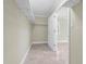 Bright walk-in closet featuring tile flooring and ample shelving storage space at 181 W Minnehaha Ave, Clermont, FL 34711