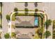 An aerial view shows a home with a private pool in a well-maintained neighborhood with lush green landscaping at 2156 Antilles Club Dr, Kissimmee, FL 34747