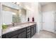 Bathroom with double vanity, granite countertops, and tiled shower for a luxurious feel at 2156 Antilles Club Dr, Kissimmee, FL 34747