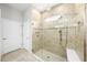 Modern bathroom featuring a tiled, glass-enclosed shower with multiple shower heads at 2156 Antilles Club Dr, Kissimmee, FL 34747
