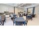 Light and bright clubhouse dining area with multiple tables and chairs and views of the community at 2156 Antilles Club Dr, Kissimmee, FL 34747