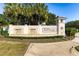 Four Seasons at Orlando community entrance featuring a stone waterfall and lush landscaping at 2156 Antilles Club Dr, Kissimmee, FL 34747