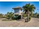 Beautiful community entrance with a guard house, lush landscaping, and a brick-paved road leading into the neighborhood at 2156 Antilles Club Dr, Kissimmee, FL 34747