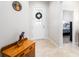 Inviting entryway with decorative door, tile flooring, and view into the bedroom at 2156 Antilles Club Dr, Kissimmee, FL 34747