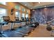 Bright gym featuring state-of-the-art treadmills, elliptical machines, weights, and a large decorative wall at 2156 Antilles Club Dr, Kissimmee, FL 34747