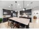 Spacious kitchen with granite countertops, an island with seating, and stainless steel appliances, perfect for entertaining at 2156 Antilles Club Dr, Kissimmee, FL 34747