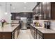 Modern kitchen featuring granite countertops, stainless steel appliances, and ample storage for the discerning chef at 2156 Antilles Club Dr, Kissimmee, FL 34747