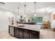 Well-designed kitchen featuring a central island, stainless dishwasher, and connecting living and dining spaces at 2156 Antilles Club Dr, Kissimmee, FL 34747