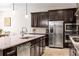 Beautiful kitchen featuring granite countertops, stainless steel appliances, and ample cabinet space for storage and convenience at 2156 Antilles Club Dr, Kissimmee, FL 34747