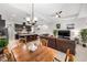 Bright open living space with kitchen island, dining area, living room with pool view, and seamless design at 2156 Antilles Club Dr, Kissimmee, FL 34747
