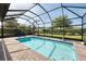 Relaxing screened-in pool with blue tiling and brick patio, perfect for entertaining or unwinding at 2156 Antilles Club Dr, Kissimmee, FL 34747