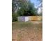 Backyard featuring a storage shed and a newly constructed wooden fence at 2233 N Normandy Blvd, Deltona, FL 32725
