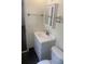 Bright bathroom with sleek white vanity, mirror cabinet and faucet, and a tiled backsplash at 2233 N Normandy Blvd, Deltona, FL 32725