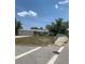 Exterior of the home set on a hill, featuring a driveway and well-kept landscaping at 2233 N Normandy Blvd, Deltona, FL 32725