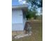 Exterior view of the home showing the siding, address, and part of the backyard at 2233 N Normandy Blvd, Deltona, FL 32725