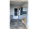 Charming front porch features slate tile flooring, a white door, and a dark shutter at 2233 N Normandy Blvd, Deltona, FL 32725