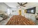 Comfortable bedroom with a calming color scheme, ceiling fan, and convenient access to the en-suite bathroom at 2354 Barons Ct, Tavares, FL 32778