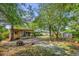 Fenced backyard with a fire pit and storage shed at 2357 E Dana Dr, Deltona, FL 32738