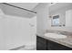 This bathroom features a shower, a granite countertop vanity, and tiled floors at 2357 E Dana Dr, Deltona, FL 32738