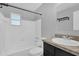 This bathroom features a shower, a granite countertop vanity, and tiled floors at 2357 E Dana Dr, Deltona, FL 32738