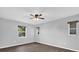 Well-lit bedroom with three windows and wood-look flooring at 2357 E Dana Dr, Deltona, FL 32738