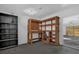 Garage featuring a custom wooden workbench with shelving and pegboard for easy tool storage and organization at 2357 E Dana Dr, Deltona, FL 32738