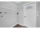 Functional laundry room with shelving and access door to exterior at 2357 E Dana Dr, Deltona, FL 32738