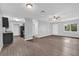 Open living area featuring wood-look flooring and a modern, neutral color palette at 2357 E Dana Dr, Deltona, FL 32738