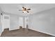 Spacious primary bedroom featuring wood-look flooring and multiple access doors at 2357 E Dana Dr, Deltona, FL 32738