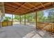 Covered patio overlooking a spacious backyard and beautiful landscaping at 2357 E Dana Dr, Deltona, FL 32738