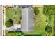 Aerial view showcasing the home's roof, driveway, and well-manicured lawn at 245 Amador Cir, Orlando, FL 32810