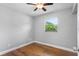 This bedroom features hardwood floors and natural light at 245 Amador Cir, Orlando, FL 32810