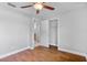 Bedroom featuring wood floors, closet space, and access to another room at 245 Amador Cir, Orlando, FL 32810