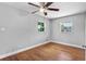 This bedroom features two windows and hardwood floors at 245 Amador Cir, Orlando, FL 32810