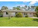 Well-kept lawn and clean exterior create an inviting curb appeal at 245 Amador Cir, Orlando, FL 32810